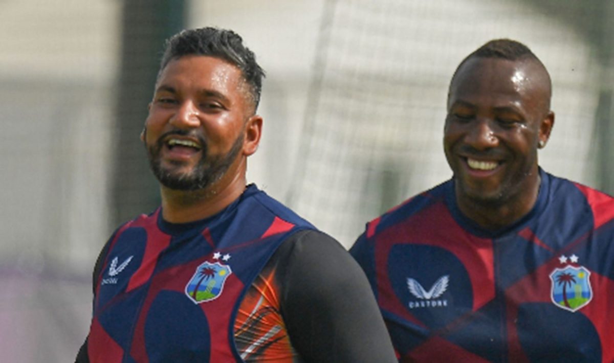 Ravi Rampaul (left) and Andre Russell share a light moment during recent training session. 
