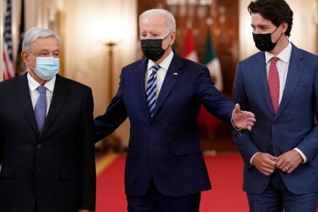 US President Joe Biden (centre) walks with Mexican President Andres Manuel Lopez Obrador, left, and Canadian Prime Minister Justin Trudeau to a meeting in the White House [File: Susan Walsh/AP Photo]
