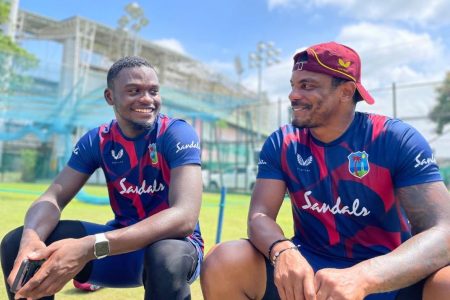 Jayden Seales (left) has a chat with his fellow fast bowler and countryman, Shannon Gabriel.