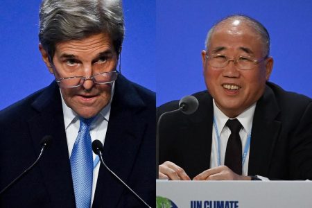 US climate envoy John Kerry(left) and his Chinese counterpart Xie Zhenhua (right) unveiled a deal to ramp up cooperation tackling climate change, including by cutting methane emissions, phasing out coal consumption and protecting forests at the United Nations climate conference in Scotland. 