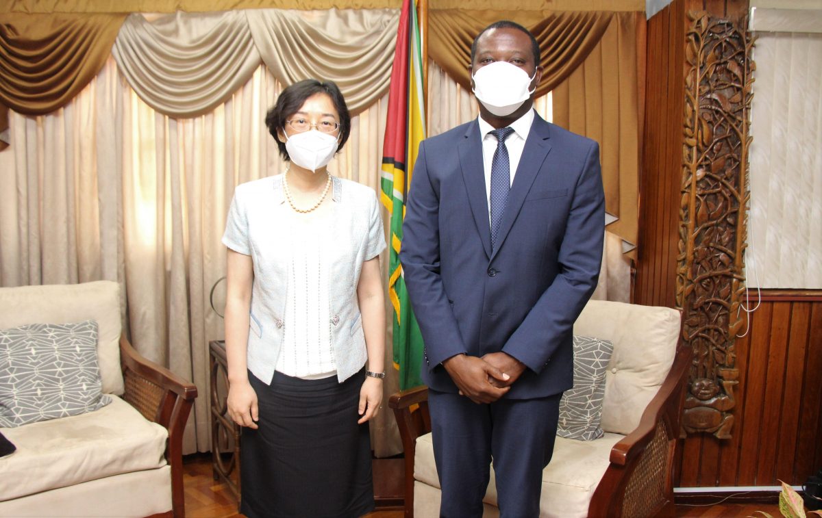 Minister of Foreign Affairs Hugh Todd with  China’s new Ambassador to Guyana, Guo Haiyan