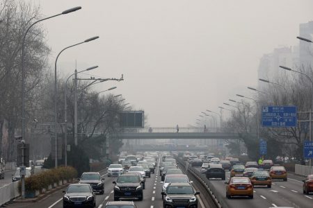 Cars drive in the city centre, on the day of closing session of the Chinese People’s Political Consultative Conference (CPPCC), during a polluted day in Beijing, China, March 10, 2021. REUTERS/Thomas Peter/File Photo