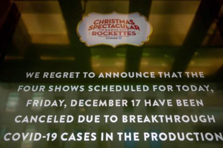 A screen shows the cancellations of The Rockettes performance due to Covid-19 cases on Friday in New York. — AP