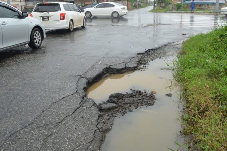 A pothole near the junction (Orlando Charles photo)