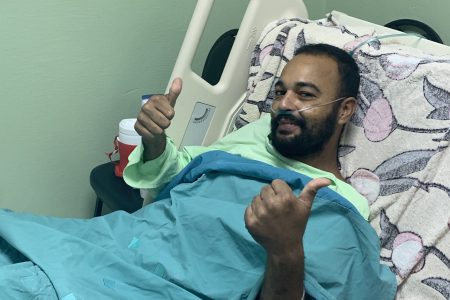 Christopher James giving members of the press two thumbs up while in hospital yesterday