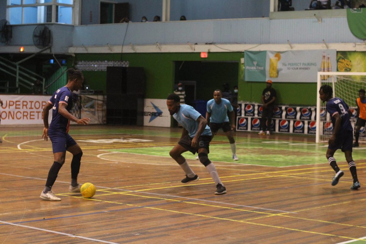 Gregory Richardson (left) in the process of attempting an attacking play against Berbice All-Stars