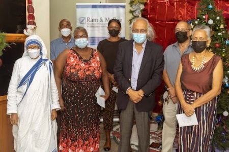 In photo are Sis. Adline Grace - Missionaries of Charity, Joan Stephens - Red Cross Convalescent Home, Pastor Gary Erskine -Dharma Shala, Osilla Harte - David Rose Special Needs School, Patrick de Groot - Beacon Foundation, and Denise Boodie - Uncle Eddie’s Home, with Ram and McRae’s Managing Partner Christopher Ram after receiving the donations. 