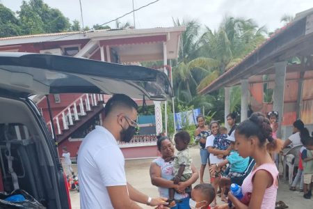 Businessman Shahab Ali distributing toys to children