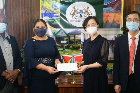 From left to right are UG Deputy Vice-Chancellor (Academic Engage-ment), Prof. Emanuel Cummings; UG’s Vice-Chancellor, Prof. Paloma Mohamed Martin; Ambassador of the People’s Republic of China to Guyana, Guo Haiyan; and China’s Deputy Chief of Mission,  Chen Xilai. (UG photo)