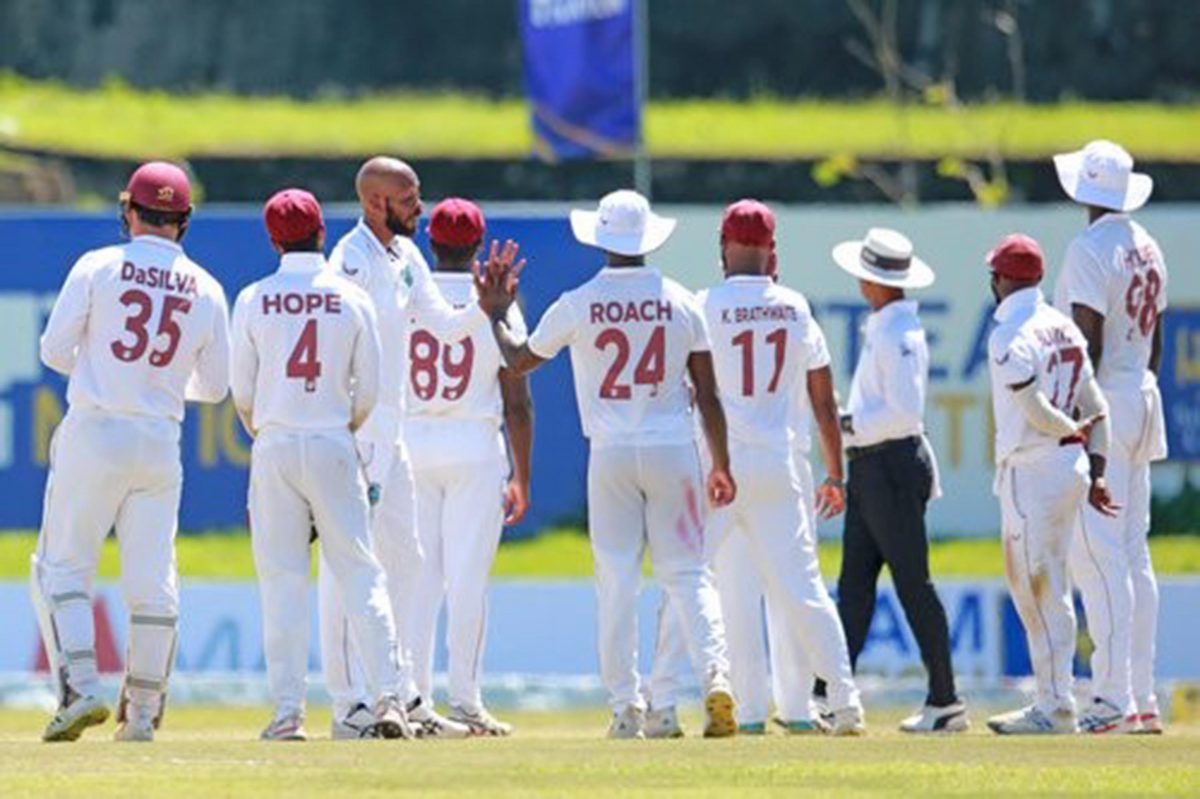 West Indies players celebrating the fall of a wicket during the second Test match against hosts Sri Lanka yesterday at the Galle International Stadium