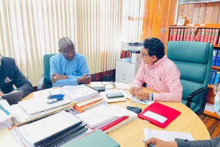 Attorney General, Anil Nandlall (right) and Professor Joe Amoako-Tuffour of Ghana at the meeting. (Ministry of Legal Affairs photo)