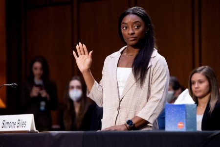 U.S. Olympic gymnast Simone Biles is sworn in to testify during a Senate Judiciary hearing about the Inspector General’s report on the FBI handling of the Larry Nassar investigation of sexual abuse of Olympic gymnasts, on Capitol Hill, in Washington, D.C., U.S., September 15, 2021. Saul Loeb/Pool via REUTERS.