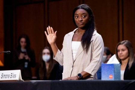 U.S. Olympic gymnast Simone Biles is sworn in to testify during a Senate Judiciary hearing about the Inspector General’s report on the FBI handling of the Larry Nassar investigation of sexual abuse of Olympic gymnasts, on Capitol Hill, in Washington, D.C., U.S., September 15, 2021. Saul Loeb/Pool via REUTERS.