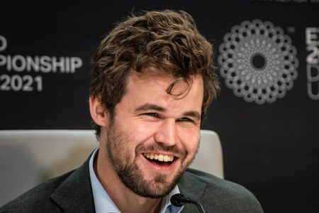 World Champion again! Norway’s Magnus Carlsen is all smiles as he wins the world chess championship for a fifth consecutive time.  (Photo: Eric Rosen /FIDE)