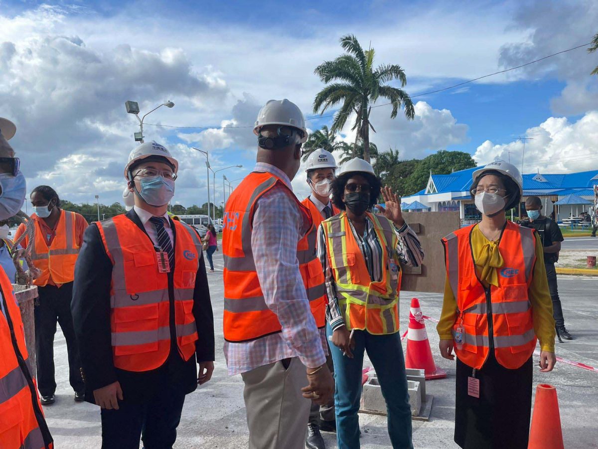 Project Engineer Carissa Gooding (second from right) updating Minister of Public Works Juan Edghill and Chinese Ambassador Guo Haiyan (right) on ongoing works 