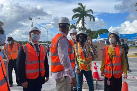 Project Engineer Carissa Gooding (second from right) updating Minister of Public Works Juan Edghill and Chinese Ambassador Guo Haiyan (right) on ongoing works 