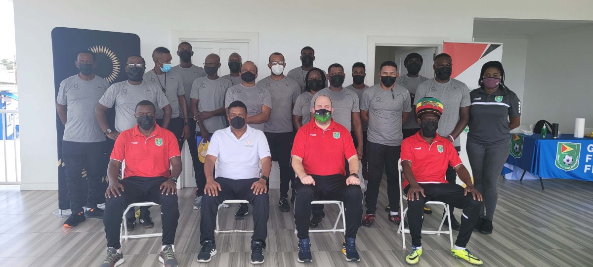 Participating coaches at the first stage of the Concacaf C License course pose for a photo opportunity at the conclusion of the forum.