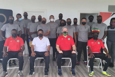 Participating coaches at the first stage of the Concacaf C License course pose for a photo opportunity at the conclusion of the forum.
