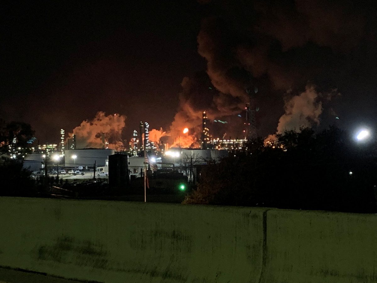 View from the road of a fire at petrochemical company ExxonMobil’s refinery near Houston in Baytown, Texas, U.S., December 23, 2021 in this image obtained from social media. Molly Fitzpatrick via REUTERS