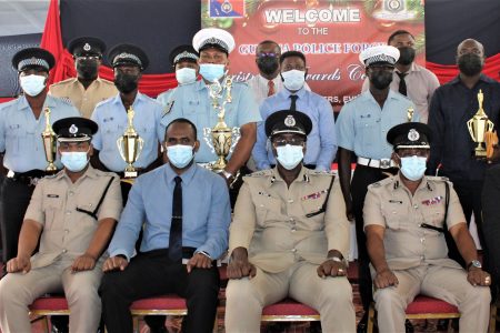 The Guyana Police Force yesterday made its annual payout of cash and incentives for policemen and women who performed outstandingly. This police photo shows some of the awardees with senior members of the force. (Police photo)