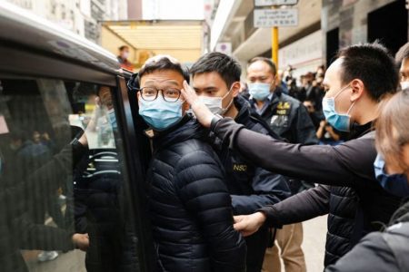 Standard News Acting Chief Editor Patrick Lam being arrested. (Reuters/Tyrone Siu)