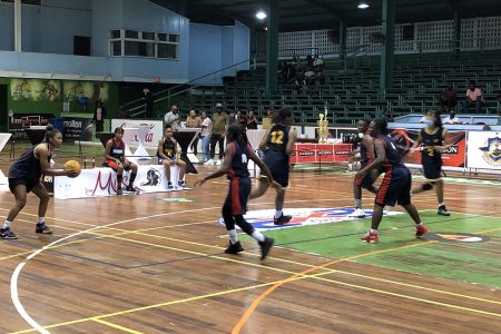 A Scene from the Georgetown and Kwakwani   female exhibition matchup at Friday night’s launch of the Rawle Toney 3x3 Classic at the Cliff Anderson Sports Hall.