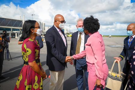 Ministers Oneidge Walrond and Juan Edghill along with InterCaribbean CEO Trevor Saddler greet Barbadian Minister of Tourism and International Transport, Lisa Cummins (right) after the arrival of the airline’s inaugural flight (DPI photo) 