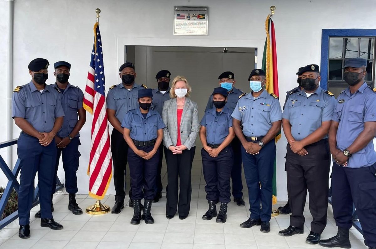 US Ambassador Sarah-Ann Lynch (centre) with members of the coast guard. (US Embassy photo)
 
