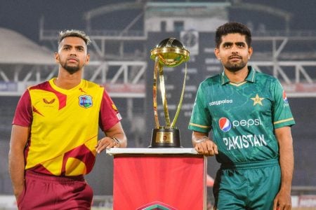 Captain Nicholas Pooran (left) and Pakistan skipper Babar Azam with the trophy at stake.