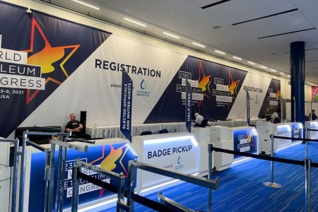 A view of a quiet registration desk for the World Petroleum Congress in Houston, Texas, U.S. on December 5, 2021 as organizers grappled with the fallout of new virus travel restrictions