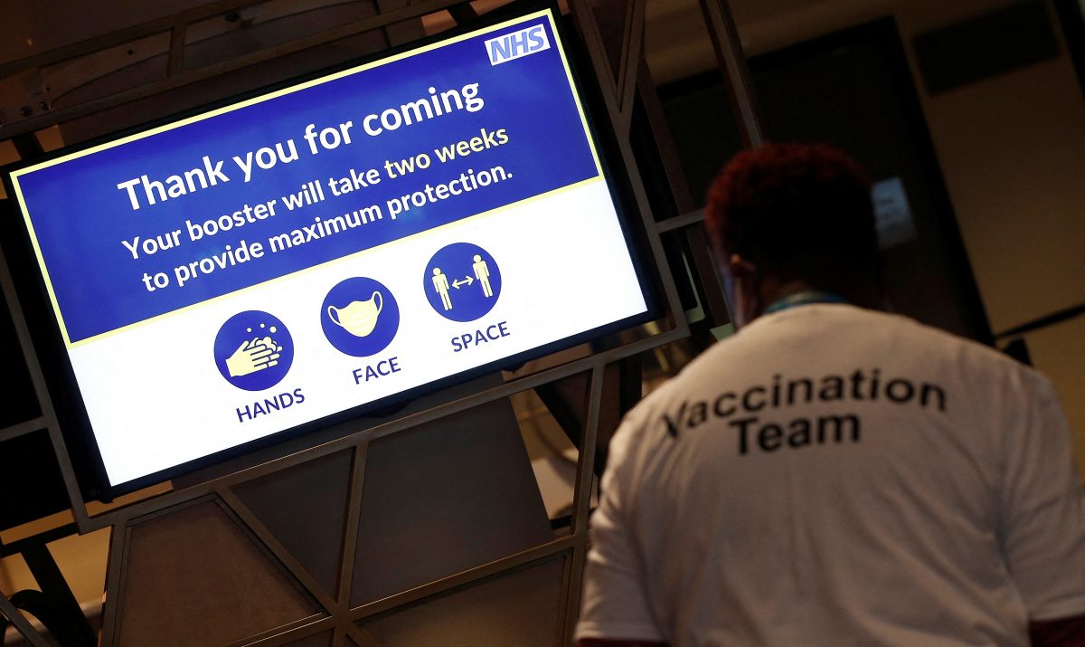 A NHS message is seen on a screen at a coronavirus disease (COVID-19) pop-up vaccination centre at Wembley Stadium in London, Britain, December 19, 2021.  REUTERS/Peter Nicholls