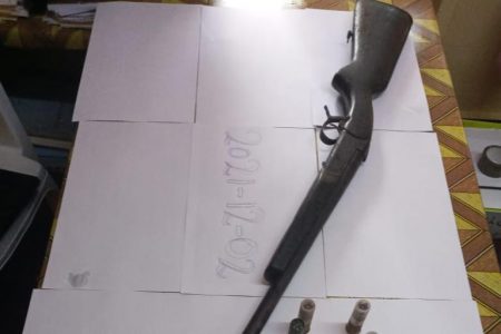 The 12-gauge shotgun and seven cartridges that were found. 
