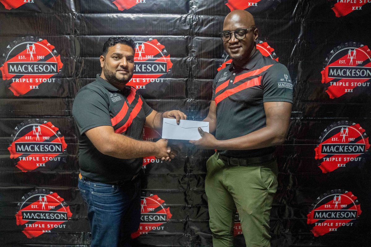 Guyana Breweries Incorporated Country Manager, Kelvin Singh (left) presenting the sponsorship cheque to tournament organizer of the Rawle Toney 3X3 Classic Rawle Toney.