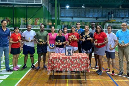 Guyana Badminton cxecutives, Darrell Carpenay and Marlon Chung with the winners