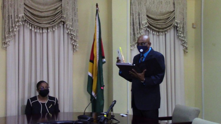 GECOM’s new CEO Vishnu Persaud taking his oath of office as Commissioner of Registration before acting Chief Justice Roxane George 