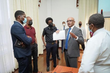 Vice-President Bharrat Jagdeo (second from right) speaking to some of the attendees.

