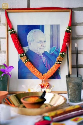 A photo of late business magnate Yesu Persaud is seen on display at his home, where a funeral service was held on Saturday (Office of the President photo) 