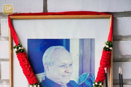A photo of late business magnate Yesu Persaud is seen on display at his home, where a funeral service was held on Saturday (Office of the President photo) 