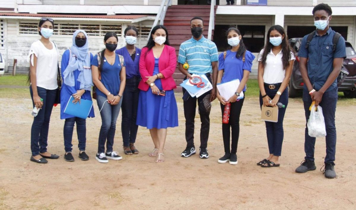 Minister of Human Services and Social Security Dr. Vindhya Persaud poses with a group from the first batch of Young Influencers during one of their outreaches in 2021. (MHSSS photo)