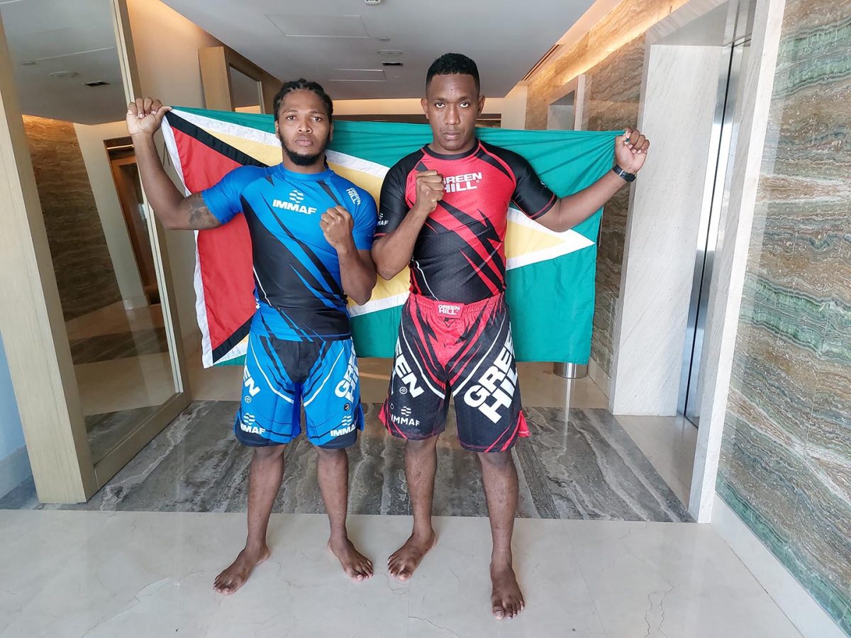 Corwin D’Anjou (L) and Ijaz Cave dressed in their battle gear and are ready to carry the Golden Arrowhead into the Octagon for the first time at the IMMAF World Championships. (Rawle Toney Photo) 