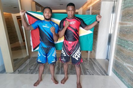 Corwin D’Anjou (L) and Ijaz Cave dressed in their battle gear and are ready to carry the Golden Arrowhead into the Octagon for the first time at the IMMAF World Championships. (Rawle Toney Photo) 