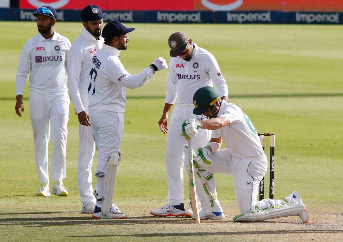 South Africa’s Dean Elgar reacts after being hit by the ball on the helmet grill off the bowling of India’s Jasprit Bumrah as Virat Kohli checks he is ok REUTERS/Rogan Ward.