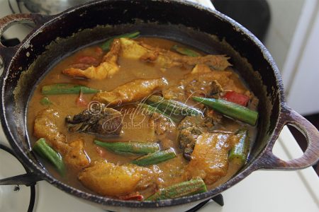 Heated coconut milk added to Fish Curry to not overcook the dish (Photo by Cynthia Nelson)