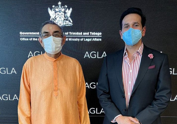 Attorney General Faris Al-Rawi (right) with a representative of the Hindu community