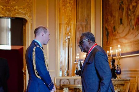 Duke of Cambridge, Prince William (left), with Sir Clive Lloyd during the investiture at Windsor Castle.