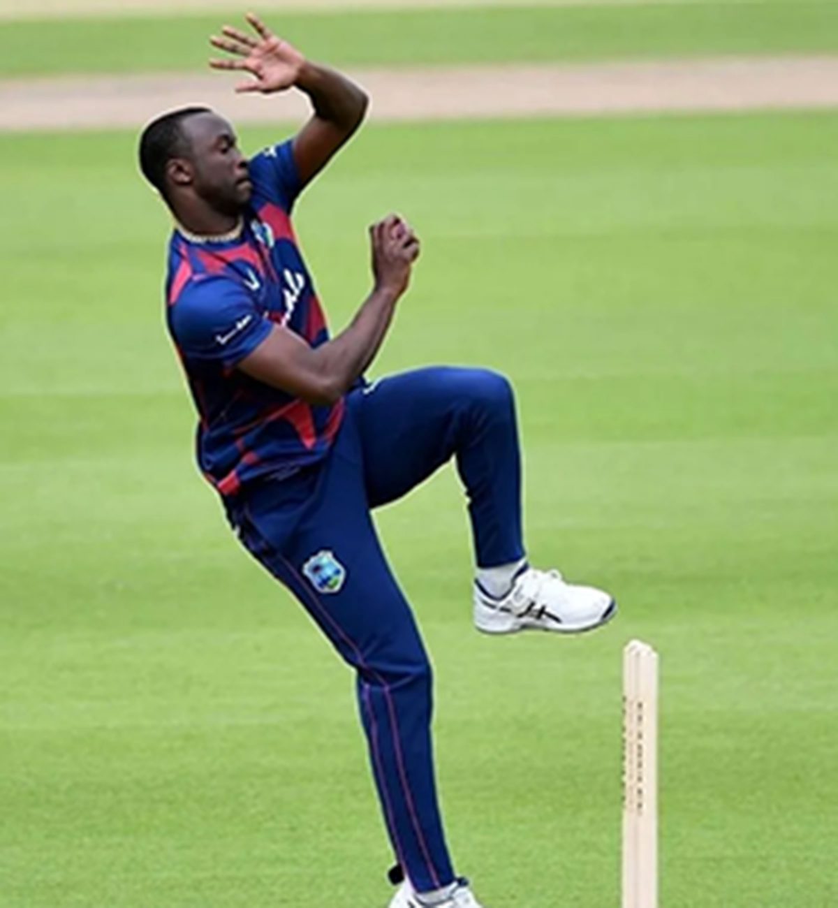 Seamer Kemar Roach celebrates after removing captain Rohit Sharma in the second ODI yesterday.