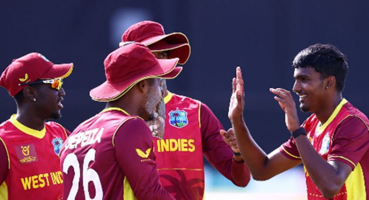 Fast bowler Shiva Sankar (right) is congratulated on another wicket during his performance yesterday. 