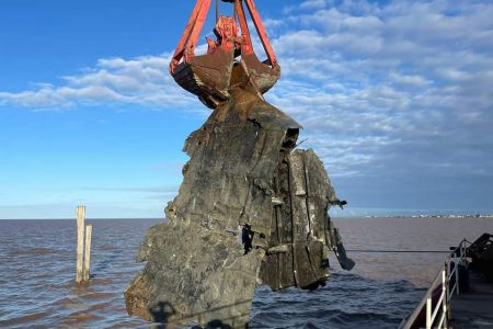 A second wreck was yesterday removed from the Demerara River. Dutch maritime solutions provider Koole Contractors was hired by the Maritime Administration Department to remove three wrecks under a $787.6 million contract.  (Ministry of Public Works photo)