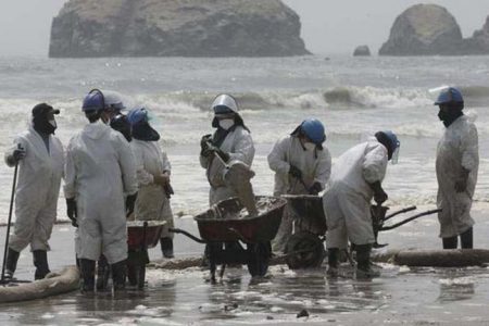 Clearing the beaches in Peru after oil spill