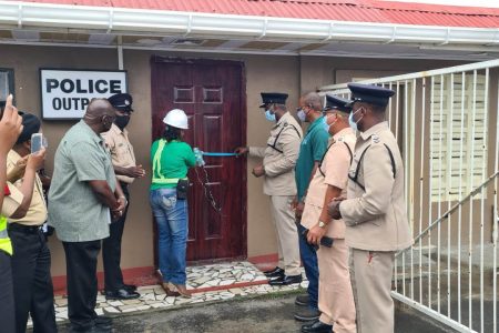  A police outpost was recently opened near the Demerara Harbour Bridge to aid in the prevention and detection of crime and to enhance the monitoring of traffic situation in the area. Commissioner of Police (ag) Nigel Hoppie received the keys to the structure from DHB General Manager Wayne Watson on Friday during a simple ceremony. Watson also handed over the keys to a motorcycle, which is to be used by the police to execute their duties. (Guyana Police Force photo)